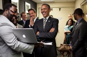Obama chuckles at the vulgar imagery being displayed on his tax payer iComputer